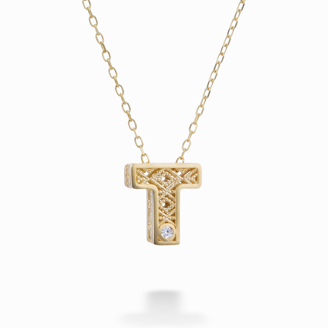 Nihama cl 18k letter t yellow gold diam. ct.0,01 NDLETTO1