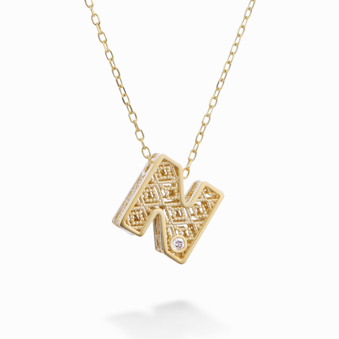 Mikiko cl 18k letra n oro amarillo diam. ct.0,01MDLETNO1