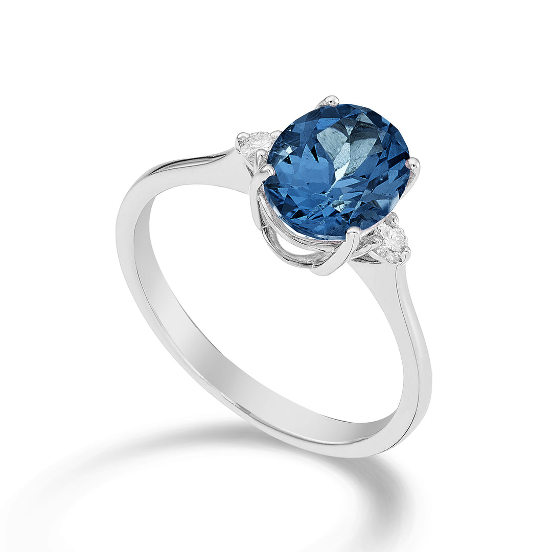 Nihama un topacio azul Londres ovalado de 18k 7x9 ct.2.00 diam. 0,08 quilates NA5143O4TPBL